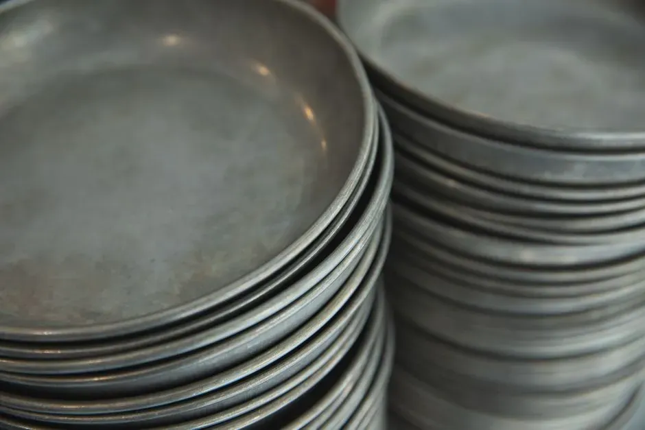6. Stacking Dishes When You're Done (Image Credits: Pexels)