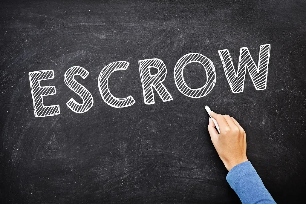 3. Padded Escrow Fees (mikecohen1872, Flickr, <a href="https://creativecommons.org/licenses/by/2.0/" target="_blank" rel="noopener">CC BY 2.0</a>)