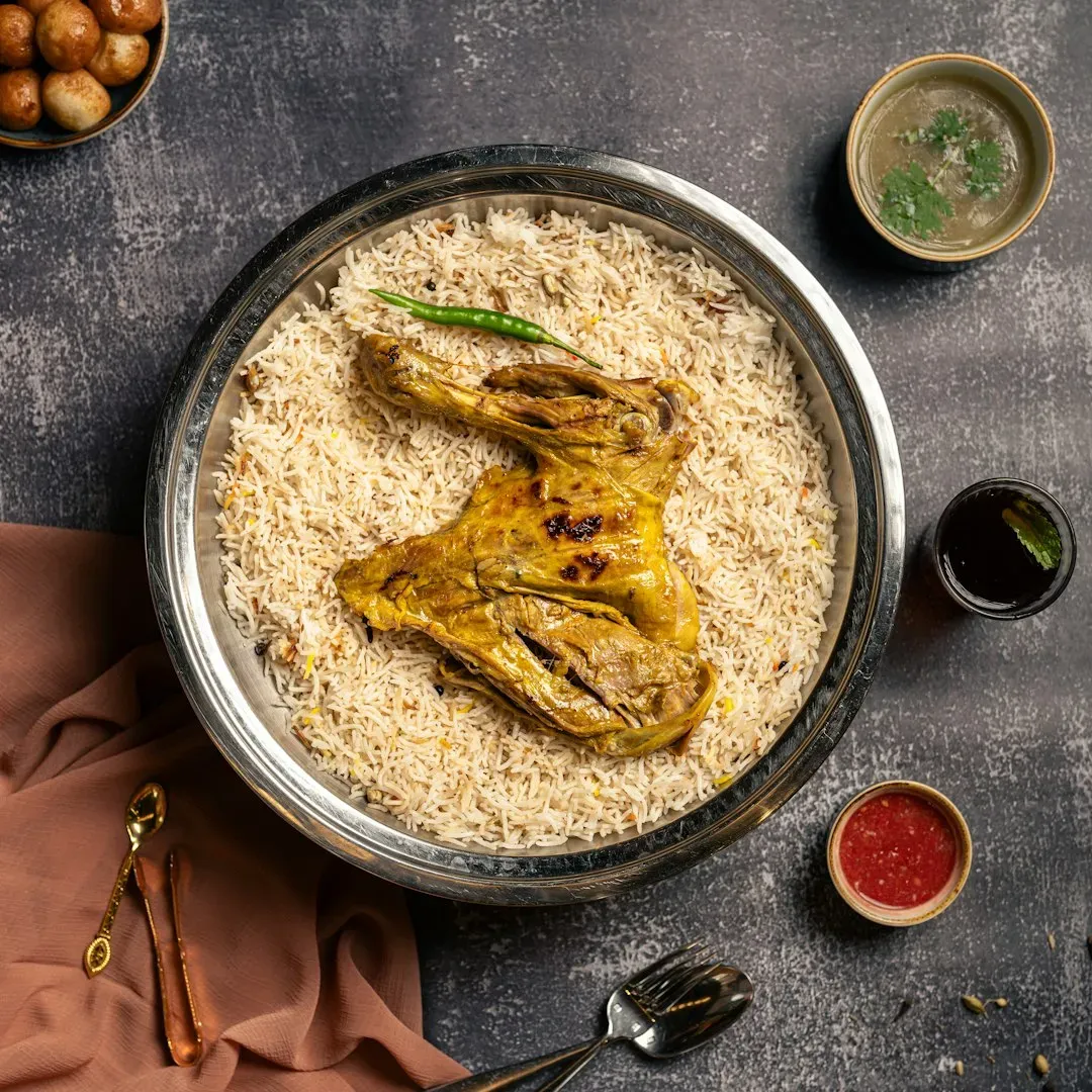 Chicken thighs and rice, cooked in one pot (Image Credits: Unsplash)