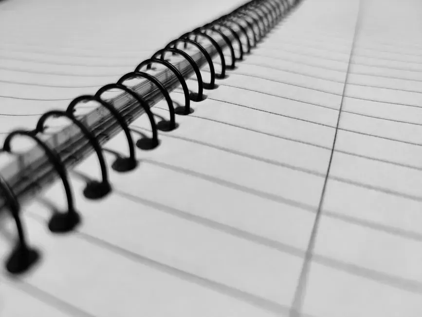 Keeping a physical rolodex or handwritten contact list (Image Credits: Pexels)
