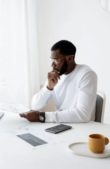 5. They Have a Calm, Practical Relationship With Debt (Image Credits: Pexels)