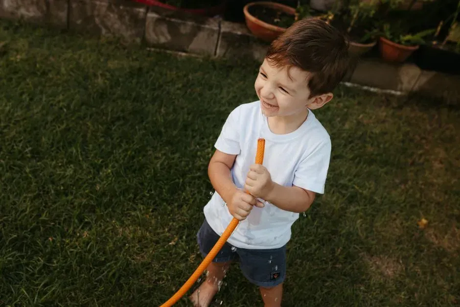 4. Letting kids drink from a garden hose or eat food off the floor (Image Credits: Pexels)