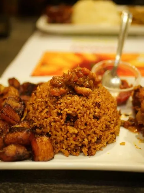 Jollof rice and chicken yassa carry West African cooking into new kitchens (Image Credits: Pexels)