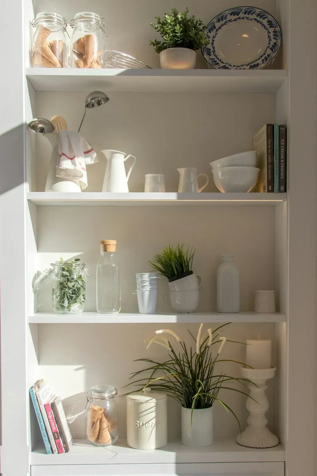 2. Open shelving stocked for looks, not use (Image Credits: Unsplash)