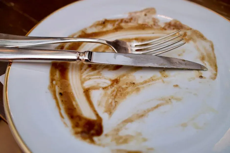 3. Finishing every single bite of food on the plate (Image Credits: Pexels)