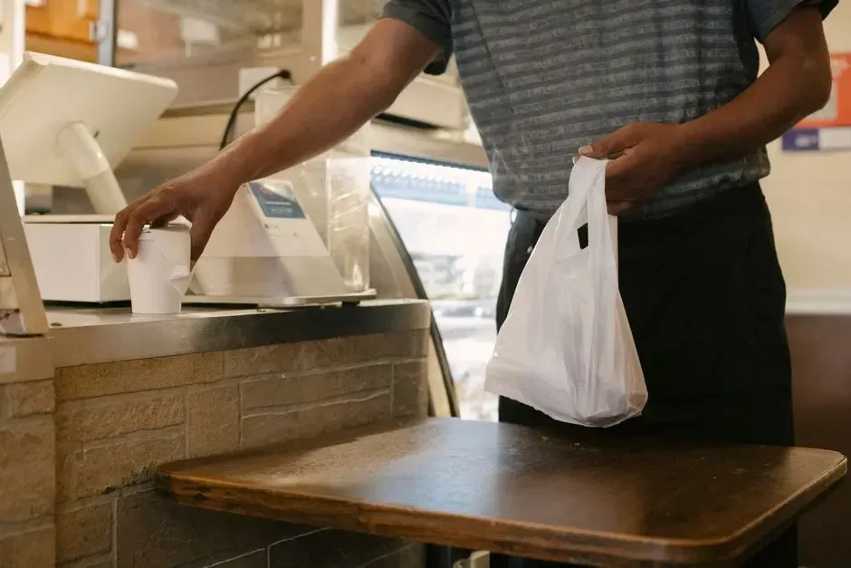 5. Asking for a bag for a single small item (Image Credits: Pexels)