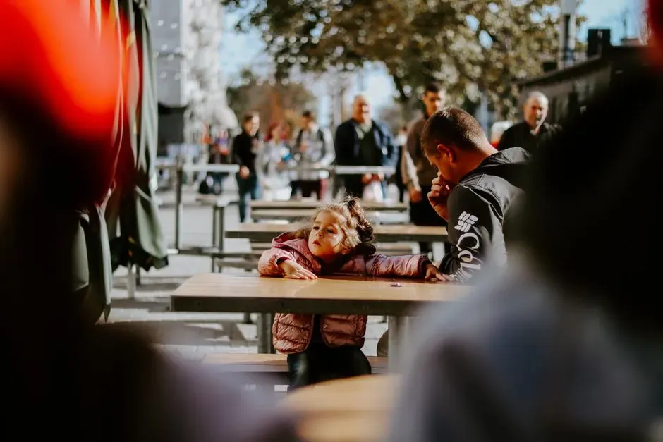 1. Letting Kids Interrupt Adult Conversations Without Consequence (Image Credits: Pexels)