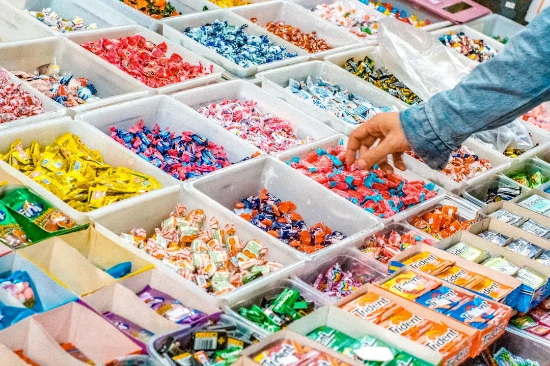 4. Candy and gum lining the checkout lane (Image Credits: Unsplash)