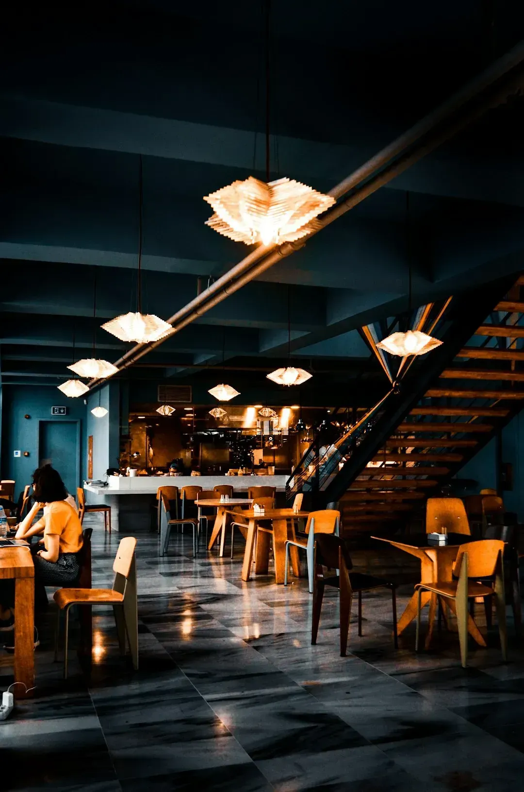 6. Speaking loudly in a quiet dining room (Image Credits: Unsplash)