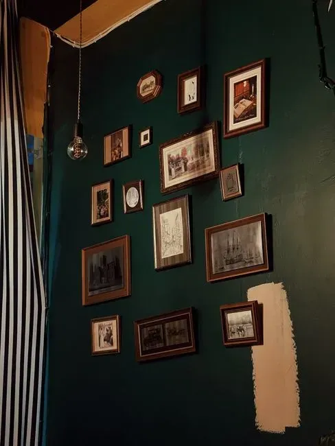 Thicker, Vintage-Style Picture Frames Replacing Thin Minimalist Ones (Image Credits: Pexels)
