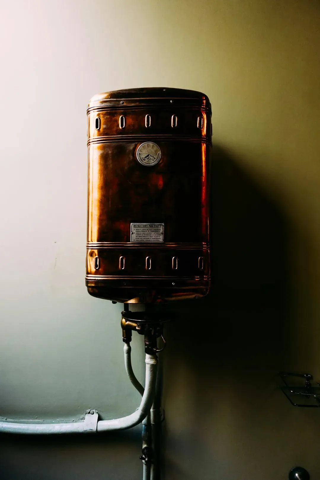 Checking the water heater and watching for leaks (Image Credits: Unsplash)