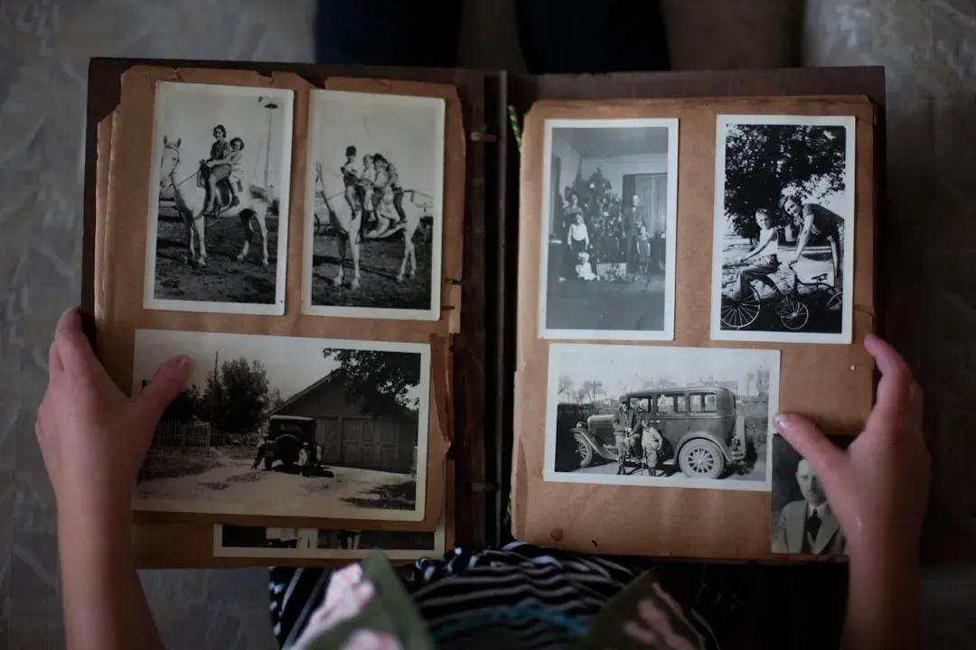 Physical Photo Albums Stacked on a Shelf (Image Credits: Unsplash)