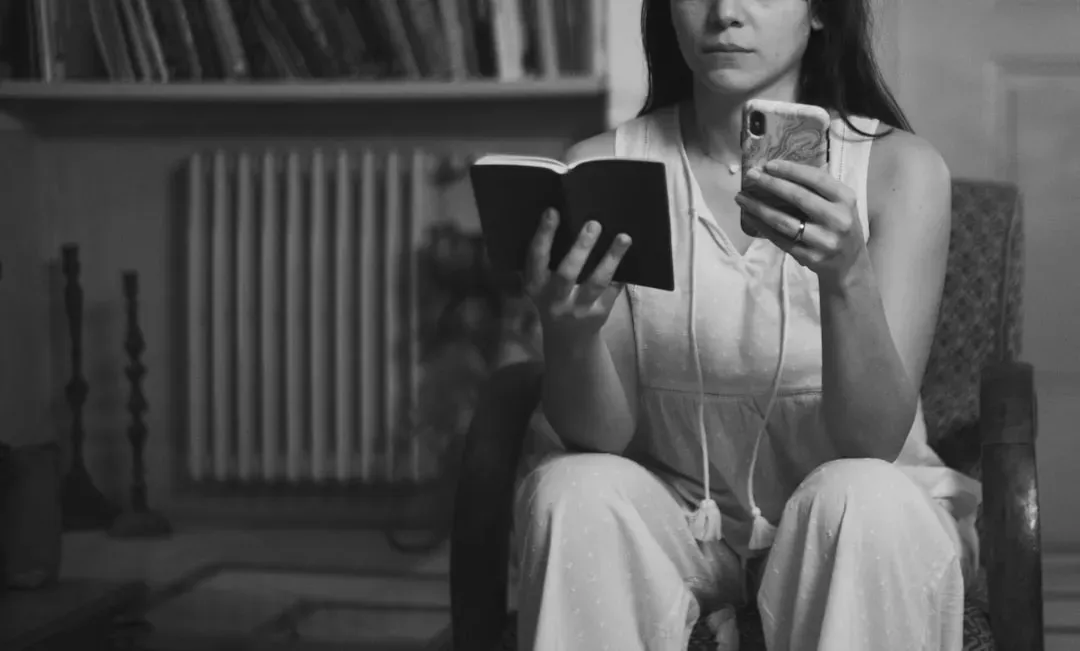 9. Writing Down Phone Numbers in a Physical Address Book (Image Credits: Unsplash)