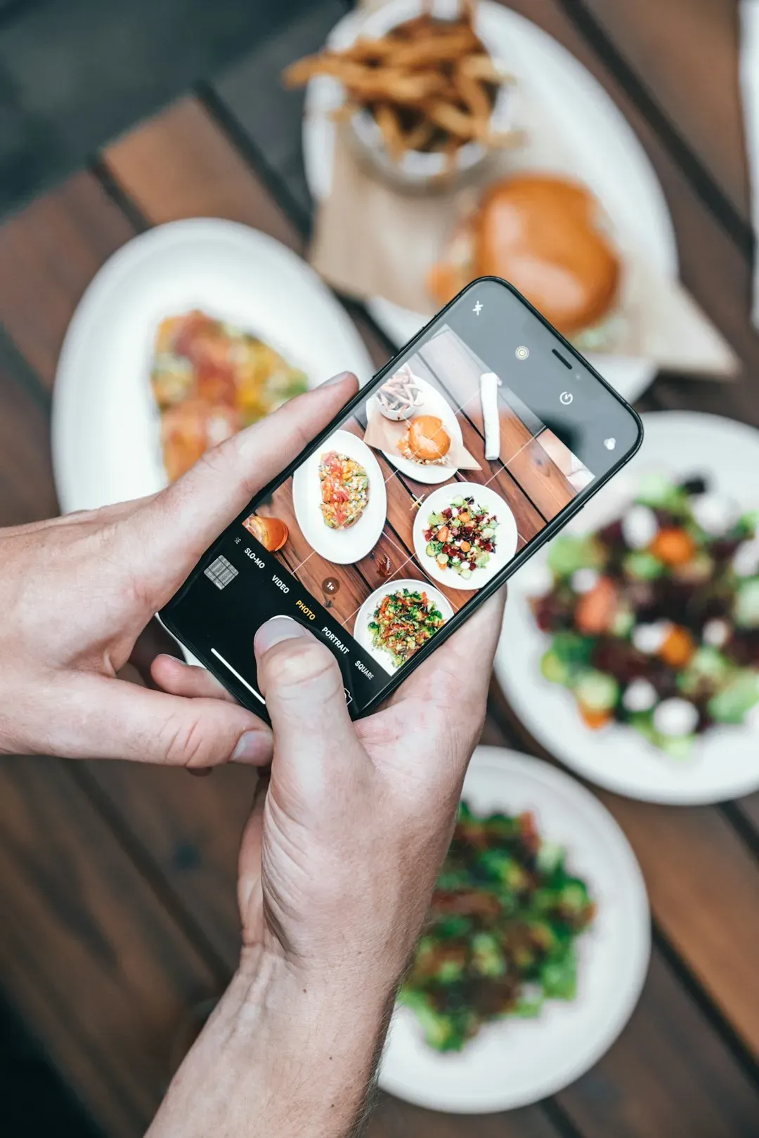 2. Talking Loudly on Your Phone at the Table (Image Credits: Unsplash)