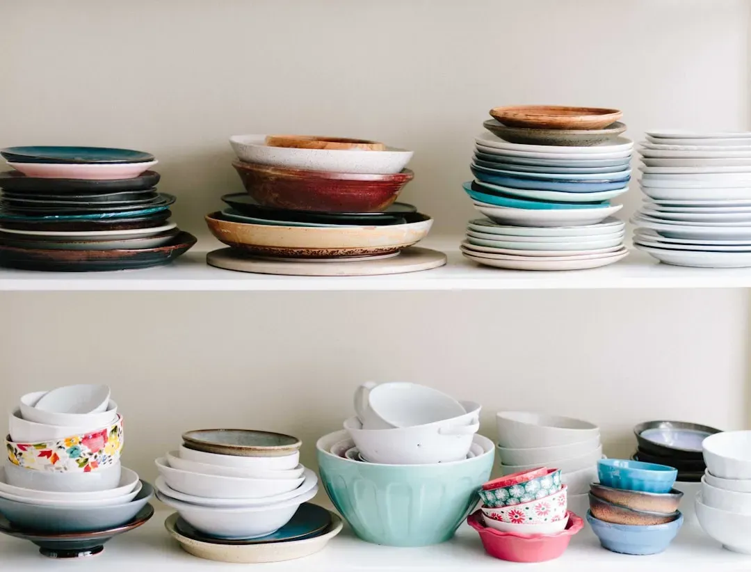7. Glass-front cabinets hiding mismatched dishware (Image Credits: Unsplash)