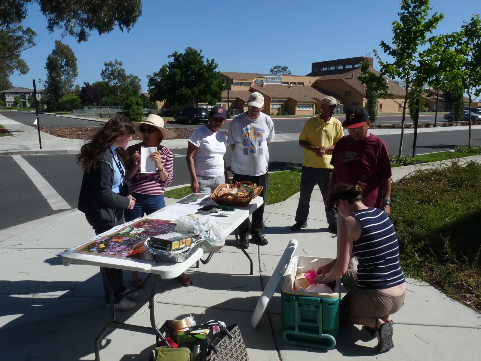 Final thoughts on three months of folding tables (Image Credits: Reaching out to neighbors, <a href="https://commons.wikimedia.org/w/index.php?curid=68916095" target="_blank" rel="noopener">Public domain</a>)