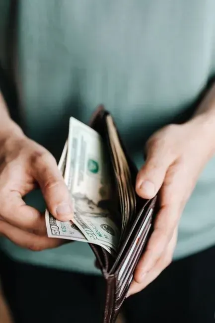 4. Carrying a wallet full of cash (Image Credits: Pexels)
