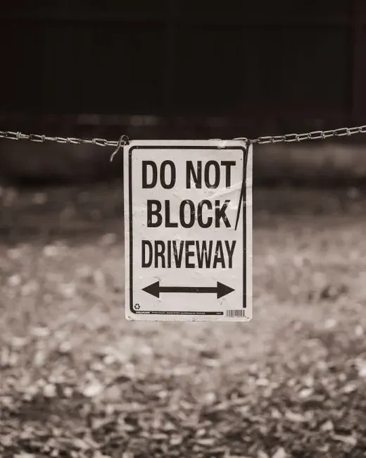 9. Parking in a way that blocks driveways or neighbors (Image Credits: Pexels)