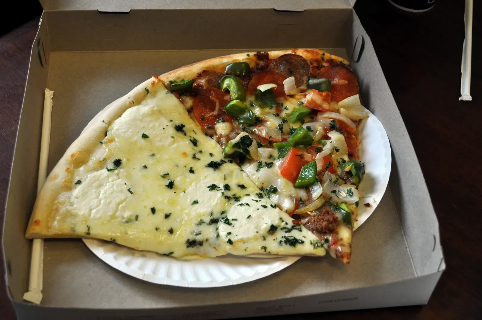 12. Costco food court pizza slice (White Slice and Supreme Slice, <a href="https://commons.wikimedia.org/w/index.php?curid=50393623" target="_blank" rel="noopener">CC BY 2.0</a>)