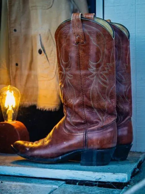 6. Cowboy boots worn purely for the tough-guy look (Image Credits: Pexels)