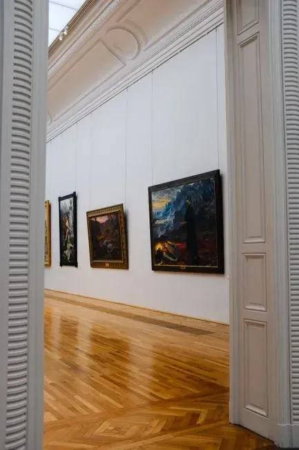 4. Frame and group artwork with intention (Image Credits: Pexels)