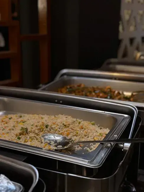 3. Double dipping with the serving spoons (Image Credits: Pexels)