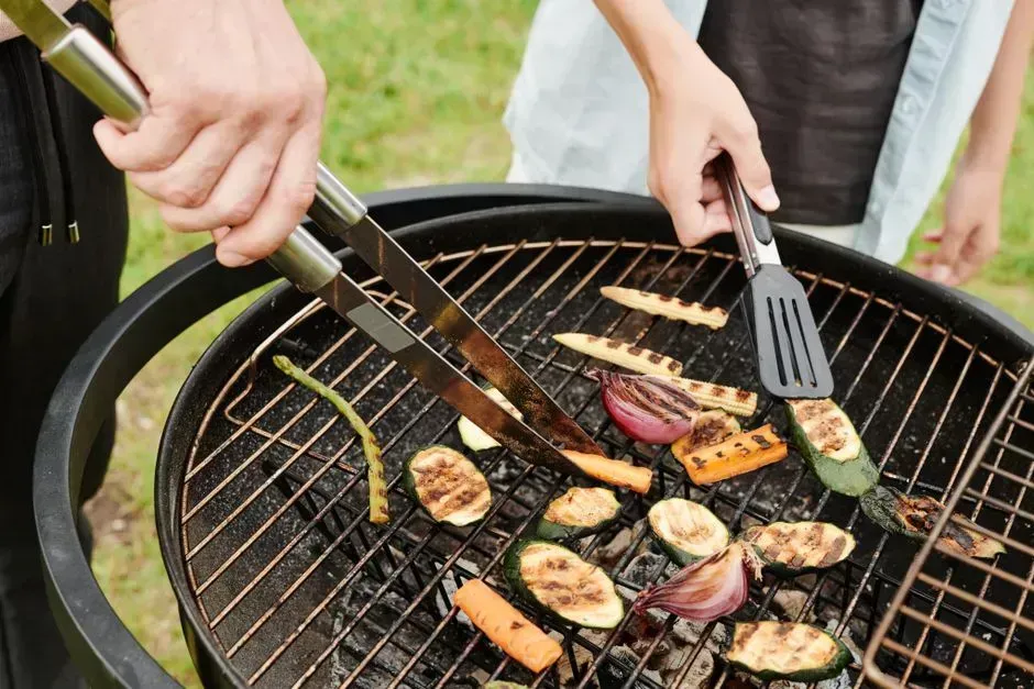 3. Rearranging food on the grill without asking (Image Credits: Pexels)