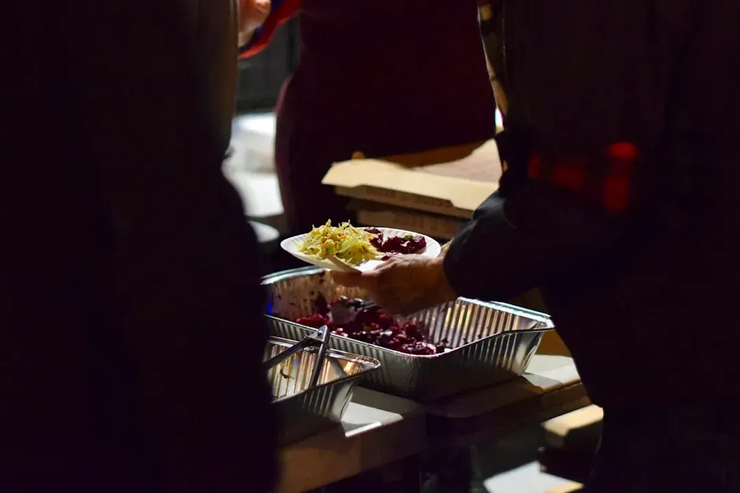 8. Putting Food Back into the Serving Trays (Image Credits: Unsplash)