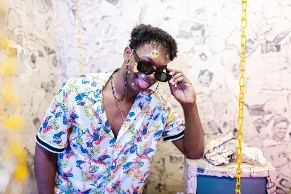 13. Wearing sunglasses with the price tag or brand sticker still visible (Image Credits: Pexels)