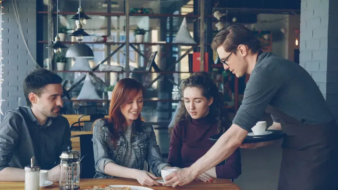 7. How You Interact with the People at Your Table (Image Credits: Unsplash)