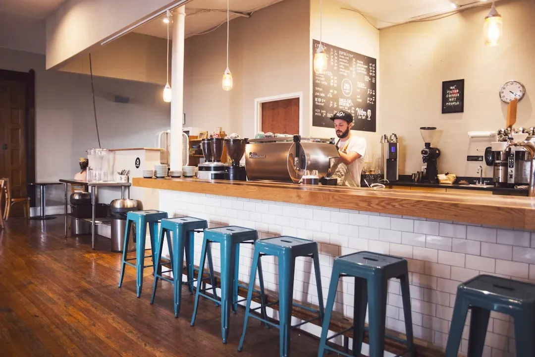 7. Standing or sitting in the wrong spot at the bar (Image Credits: Unsplash)