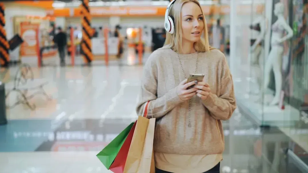 Talking loudly on the phone while shopping (Image Credits: Unsplash)