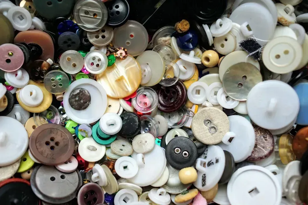 8. Boxes of buttons, zippers, and spare fasteners (Image Credits: Unsplash)