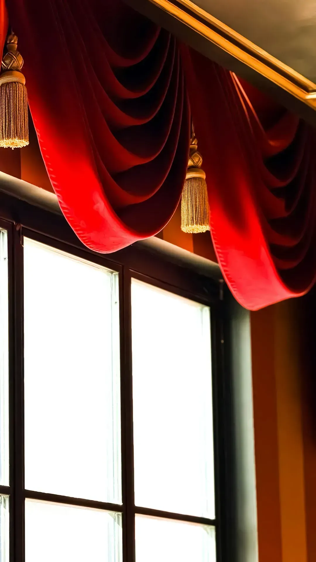 6. Heavy drapes and valances (Image Credits: Unsplash)