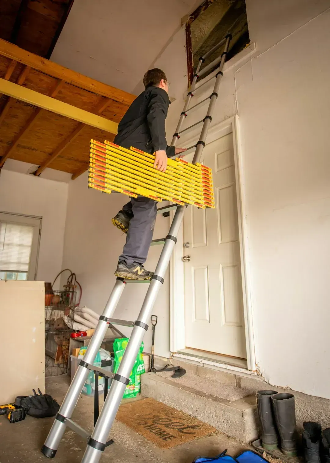 Attic Storage Reached By Pull-Down Ladders (Image Credits: Unsplash)