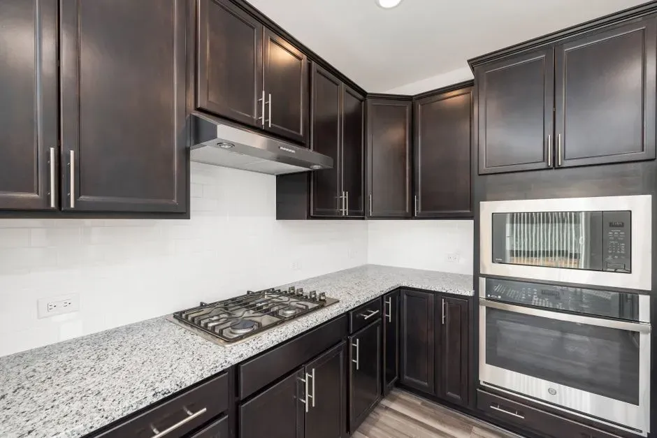 8. Dark cherry or espresso cabinetry (Image Credits: Pexels)