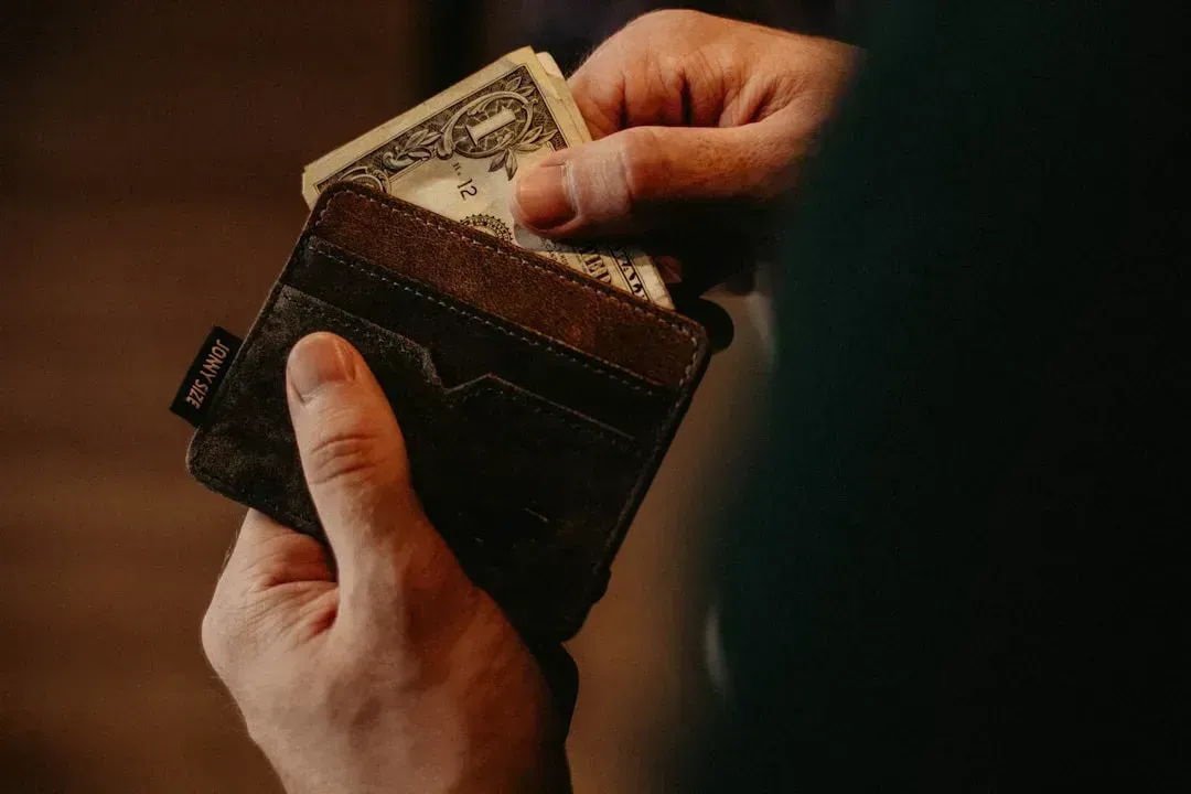 7. Using Cash for Most Purchases (Image Credits: Unsplash)