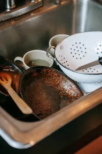 3. Sink Full of Dirty Dishes (Image Credits: Pexels)