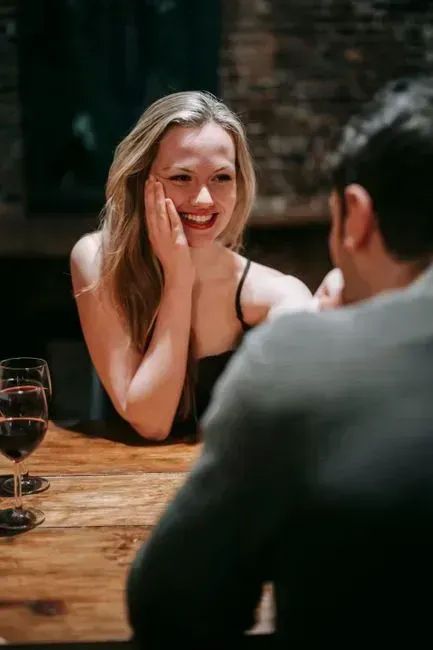 4. He compliments you but avoids anything that sounds like a declaration (Image Credits: Pexels)