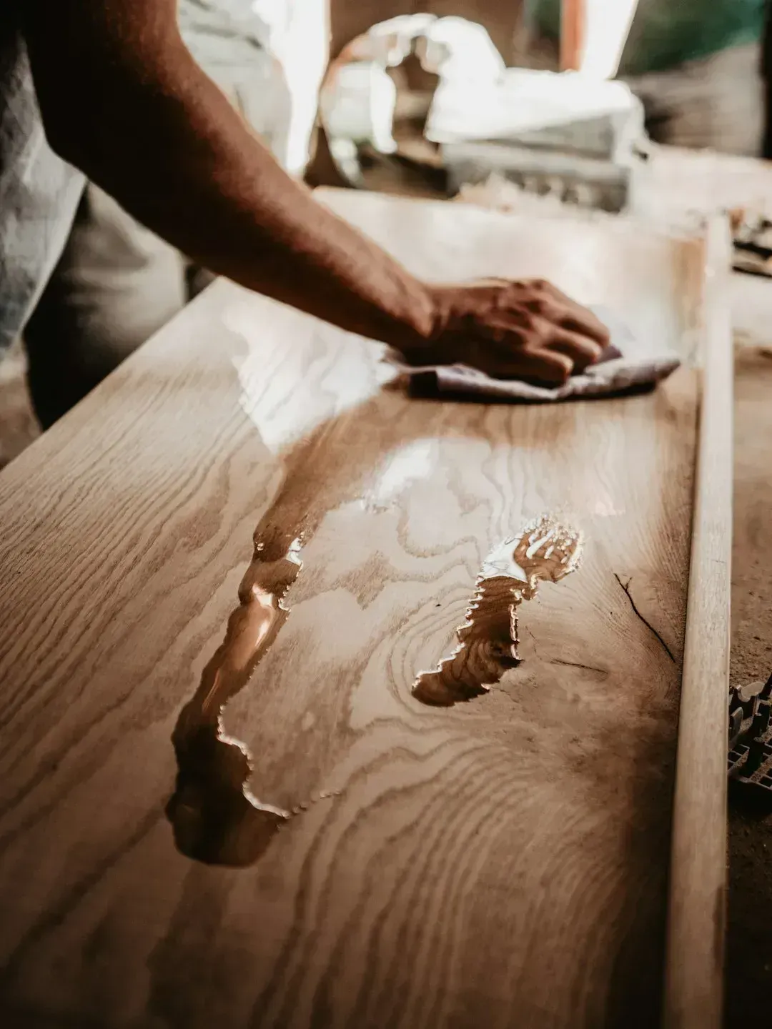 8. Polishing wood furniture with homemade mixtures (Image Credits: Unsplash)