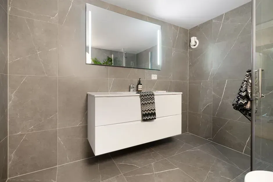 3. Lay Large-Format Floor and Wall Tiles (Image Credits: Pexels)