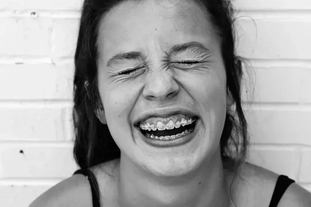 3. Being Told to Smile (Image Credits: Unsplash)
