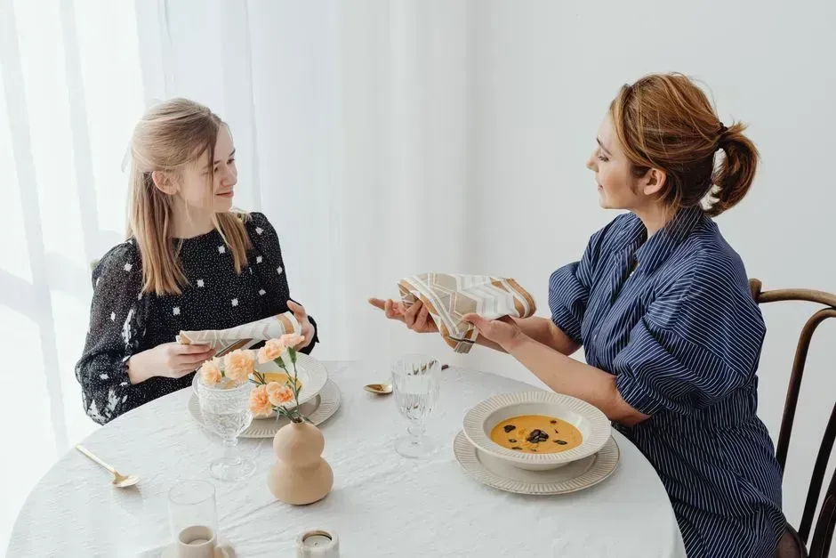 4. Clearing plates before the host is ready (Image Credits: Pexels)