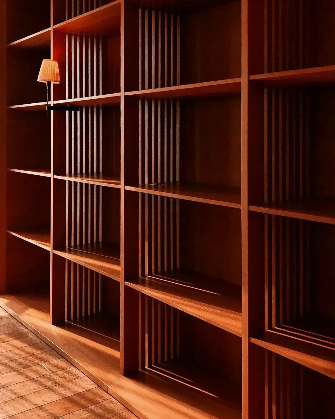 Solid wood shelving with a slatted, ventilated design (Image Credits: Unsplash)