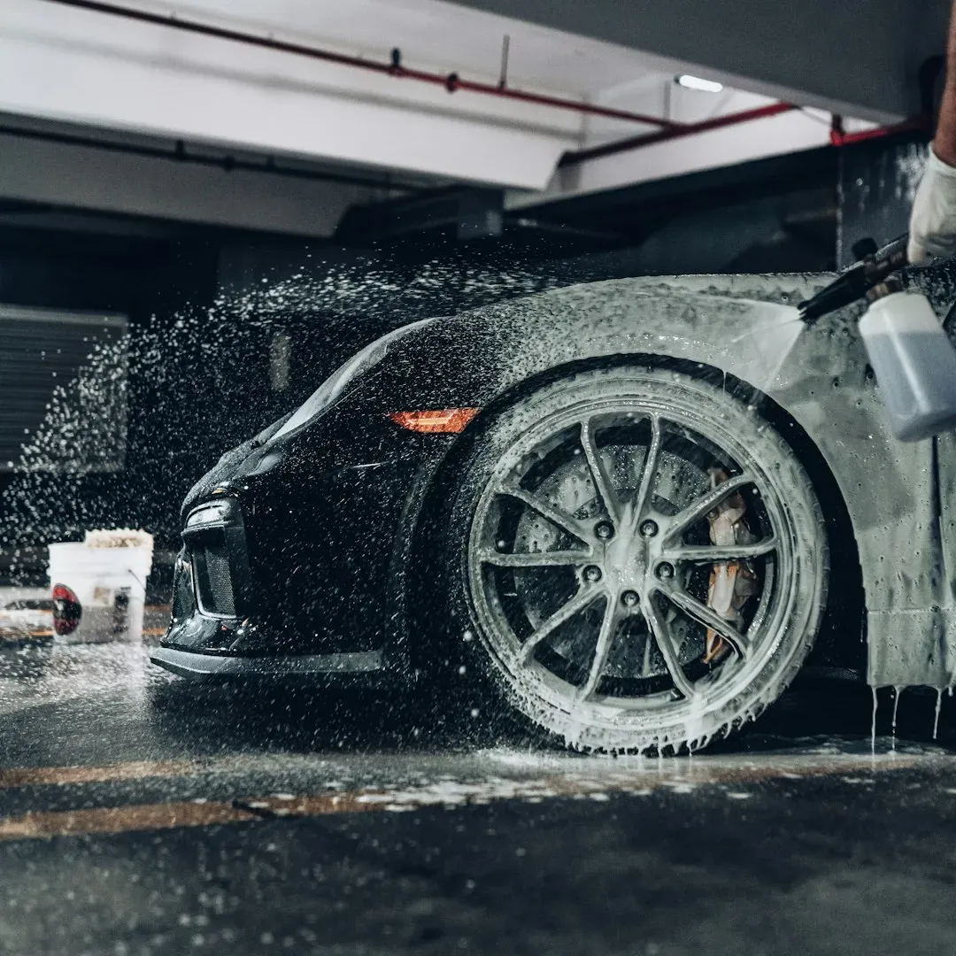 1. Washing the car in the driveway every weekend (Image Credits: Unsplash)