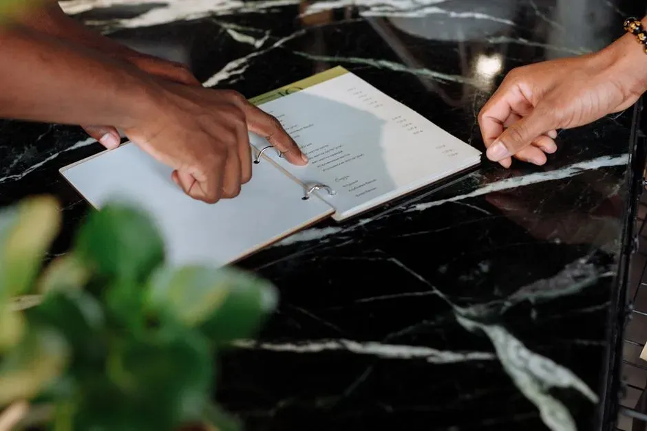 5. How You Handle the Menu (Image Credits: Pexels)