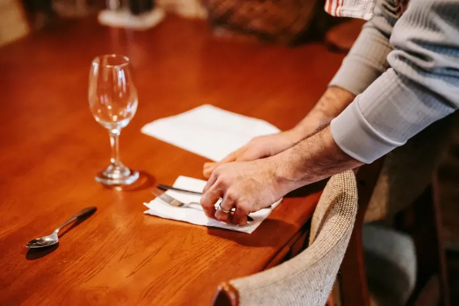 9. Placing It on the Table Before the Host Signals the Meal Is Over (Image Credits: Pexels)