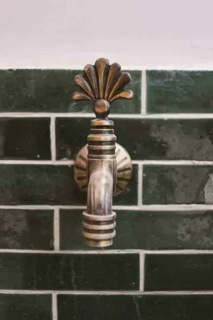 Tapping the Tile and Checking the Trim (Image Credits: Pexels)