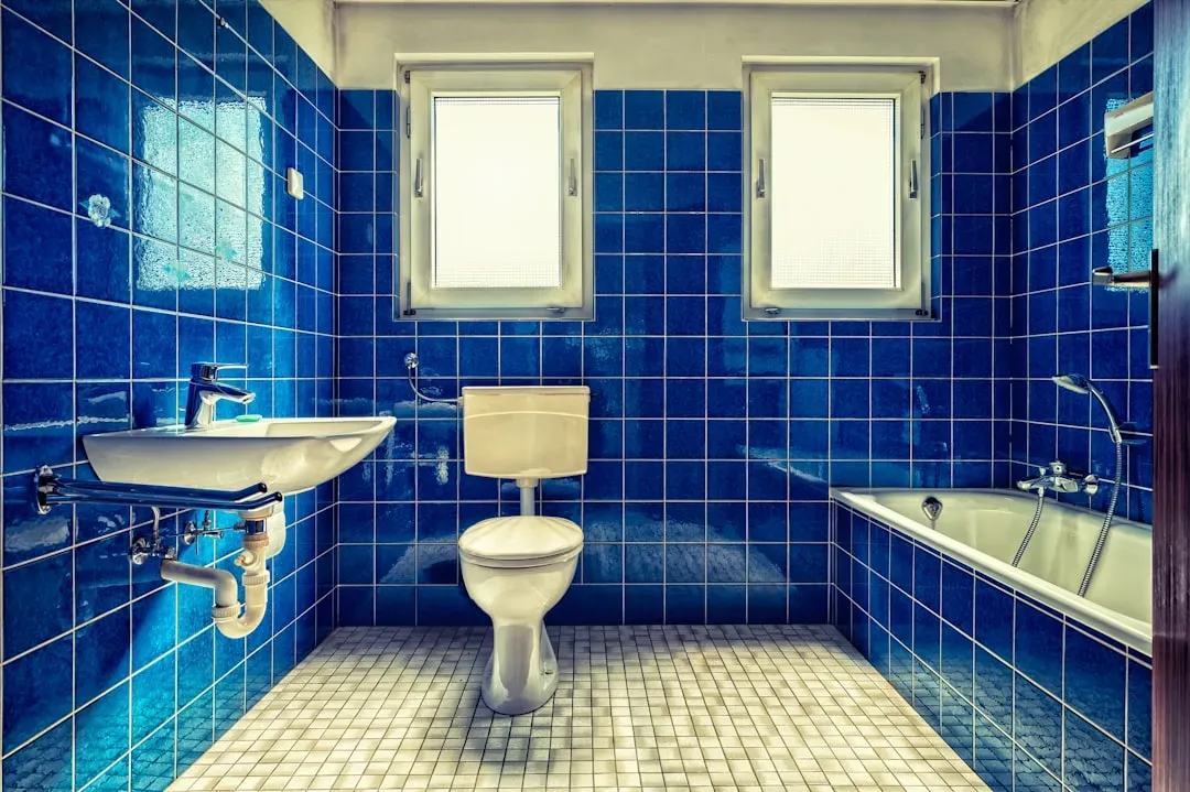 3. Black Spots on Bathroom Grout or Visible Mold in the Shower (Image Credits: Unsplash)