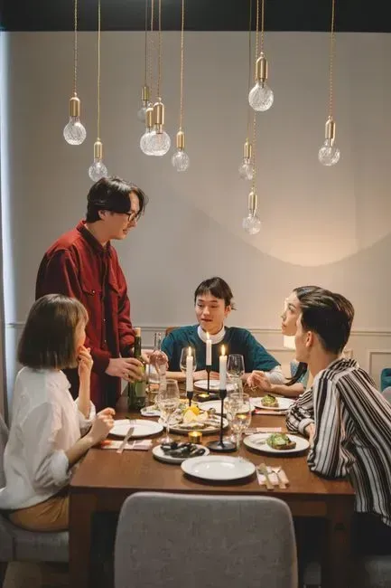 1. Hosting Get-Togethers (Image Credits: Pexels)